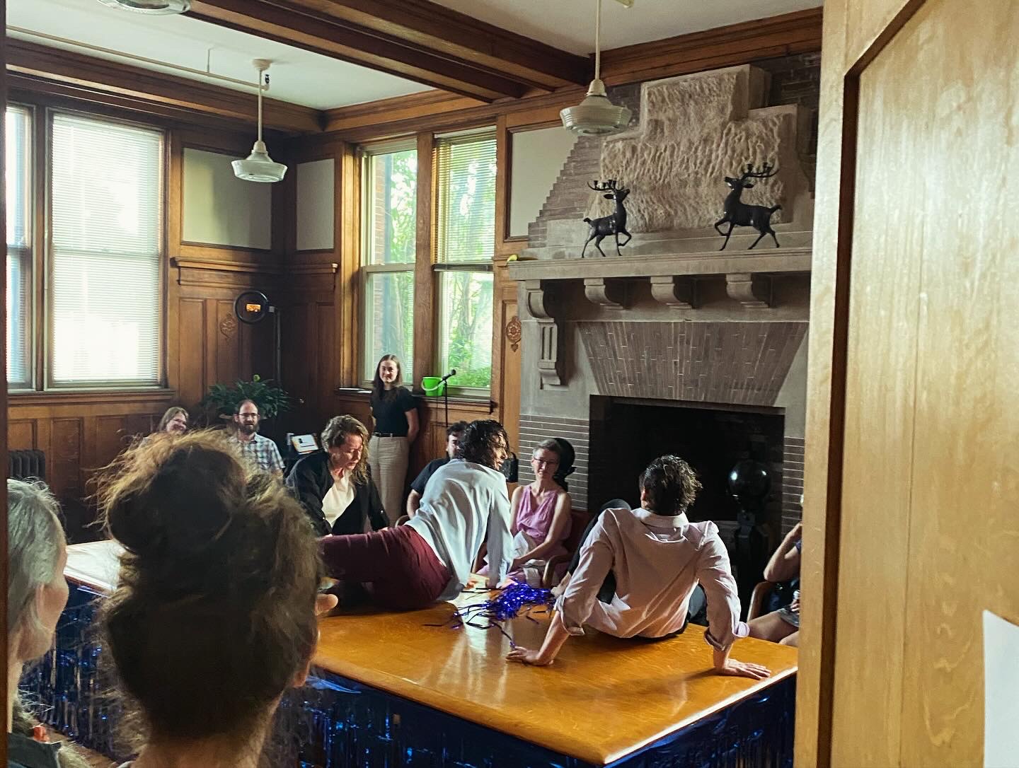 Intimate performance on bar counter in historic room with fireplace