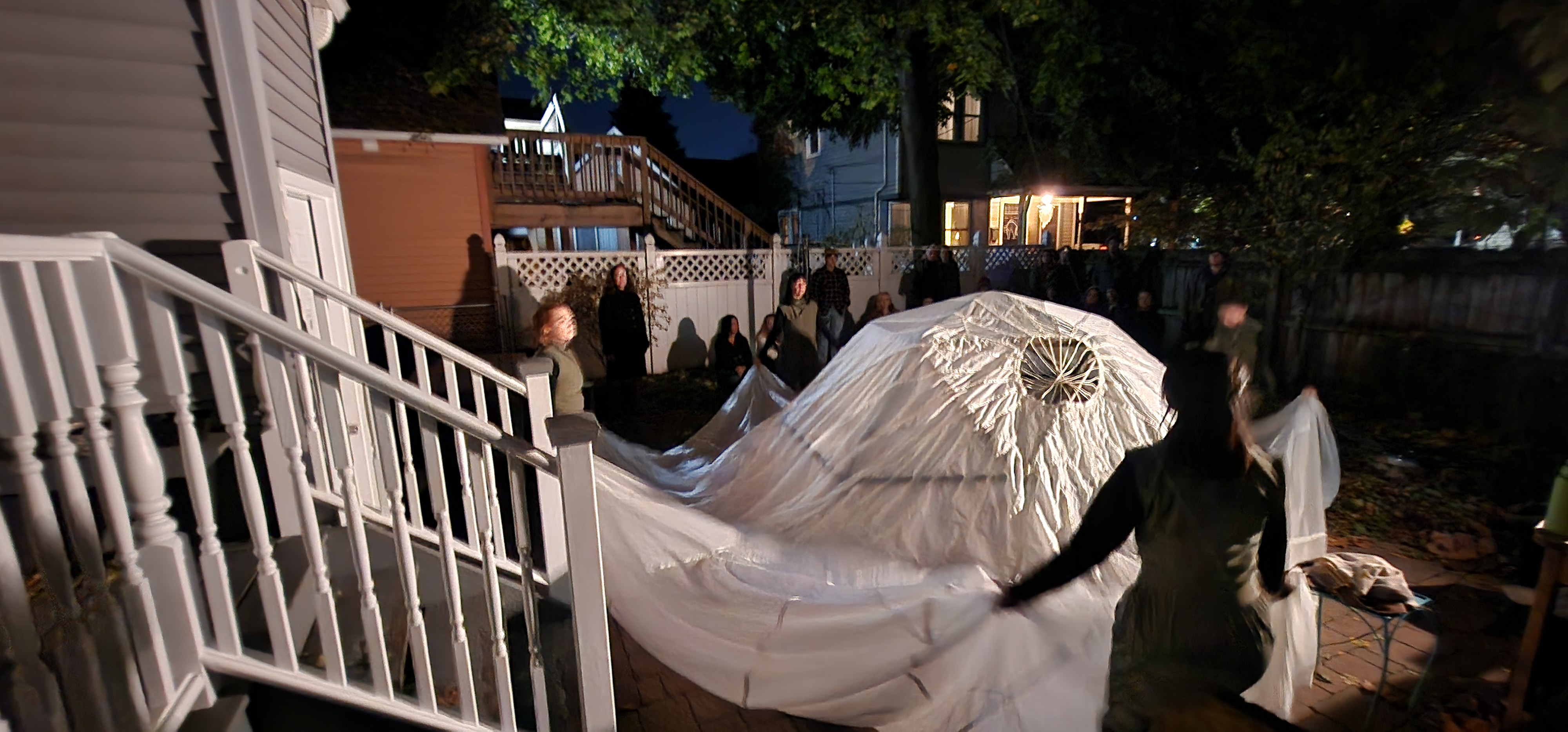 Dramatic outdoor performance with flowing white fabric
